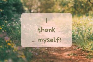 Blumenwiese im Hintergrund mit Text darauf " I thank ...myself!"